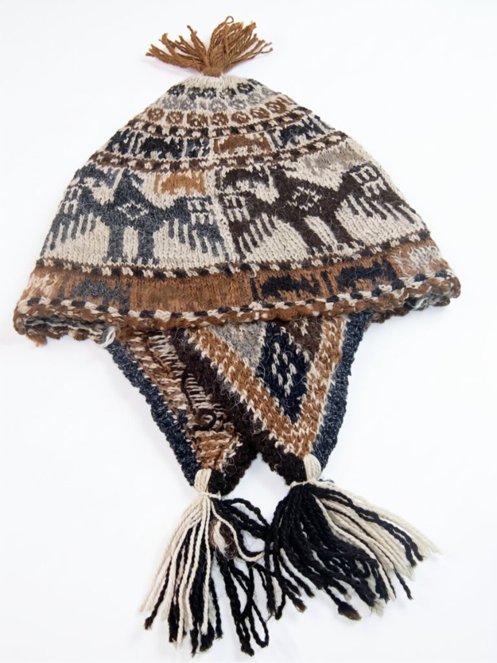 Hand-knitted Andean sheep's wool chullo with condor design and earflaps.